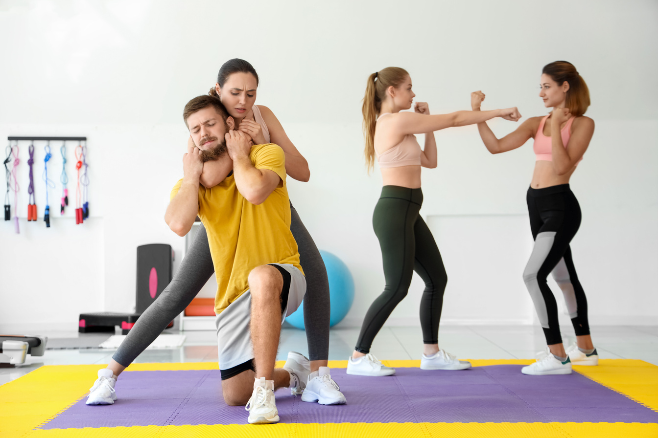 Young Women Training at Self Defense Courses in Gym